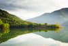 photo of scenic view of quiet lake