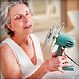 mature woman holding fan in face